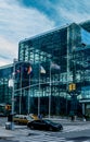 Vertical exterior view of people attending a trade show at the iconic Jacob K. Javits Convention