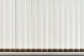 Vertical fabric blinds on the window backlit by sunlight Royalty Free Stock Photo