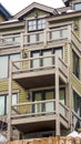 Vertical Facade of a residential building against cloudy sky on a snowy winter day