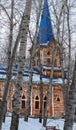 vertical, facade of wooden Lutheran church in forest. Wooden church as Fabulous house of gnomes Royalty Free Stock Photo
