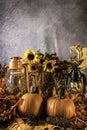 Vertical fall still life with pumpkins and sunflowers