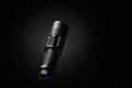 Vertical flashlight on dark background illuminated from side for dramatic contrast Royalty Free Stock Photo