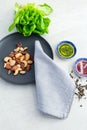 Vertical flat lay view of Mediterranean style diet ingredients, including mixed nuts, lettuce, olive oil, vinegar and dried herbs Royalty Free Stock Photo