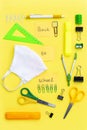 Vertical flatlay with student accessories as ruler, pencil sharpener, scissors. Royalty Free Stock Photo