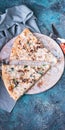 Vertical food banner. Pizza with mushrooms and cheese on a round board. Fork, knife and napkin. Pizza time concept Royalty Free Stock Photo