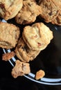 Gourmet cookies on a black plate close up. On green wood. Royalty Free Stock Photo