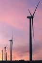 Vertical format of silhouettes of wind turbines on a farm in Iowa on a sunset sky Royalty Free Stock Photo