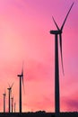 Vertical format of silhouettes of wind turbines on a farm in Iowa on a sunset sky Royalty Free Stock Photo