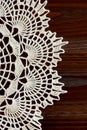 Vertical fragment of a vintage ivory crochet doily