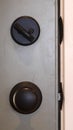 Vertical frame Close up of black door knob and unlocked latch Royalty Free Stock Photo