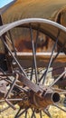 Vertical frame Close up of the rusty wheels of an old vintage tractor on a farm on a sunny day Royalty Free Stock Photo