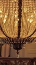 Vertical frame Close up of a stunning chandelier with sparkling and glittering crystal beads Royalty Free Stock Photo