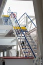 Vertical Frame of a Complex Blue and White Industrial Staircase Structure in a ship ferry, No People, Daytime, Concept of Royalty Free Stock Photo