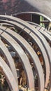 Vertical frame Damaged and rusty wheels of an old vintage tractor on a farm on a sunny day Royalty Free Stock Photo