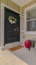 Vertical frame Front veranda and door of suburban home Royalty Free Stock Photo