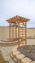 Vertical frame Heart shaped planting beds and wooden arbor at the yard of a home Royalty Free Stock Photo