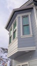 Vertical frame Home exterior in Park City Utah with bay window and gray horizontal wall siding Royalty Free Stock Photo