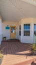 Vertical frame Long covered wooden entrance porch day light Royalty Free Stock Photo