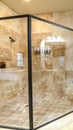 Vertical frame Modern luxury bathroom with glass shower cubicle Royalty Free Stock Photo