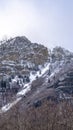 Vertical frame Natural landscape of Provo Canyon with steep slopes with frozen water in winter