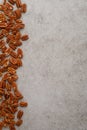 Vertical frame photo of pecan nuts on marble table Royalty Free Stock Photo