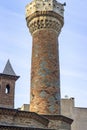 Vertical frame shoot of old ottoman built mosque minaret with masonry colorful stones structure in local places in Turkey