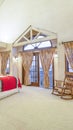 Vertical frame Spacious bedroom with beamed wooden ceiling