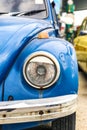 Vertical front close-up blue beetle car Royalty Free Stock Photo