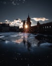 Vertical of a frozen river Spree at Oberbaumbridge with a tower silhouette background Royalty Free Stock Photo