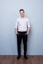 Vertical full-length portrait of smiling happy young guy dressed Royalty Free Stock Photo