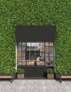 Vertical gardening facade of a store or cafe with glass entrance doors. Free space for signage. Facade is overgrown with curly ivy