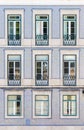 Facade of an ordinary house in Lisbon decorated with taditional ornamental azulejo tiles