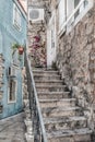 Vertical geometric vintage background with staircase outside a stone building