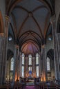 Vertical Glimpse of Saint Antoine Church: Crucifix, Stained Glass, and Domes Royalty Free Stock Photo