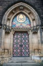 Vertical of a gothic entrance to the Saints Peter and Paul Basilica church in Prague. Royalty Free Stock Photo