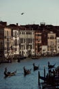 Vertical of Grand Canal with gondolas sailing along old buildings in Venice, Italy Royalty Free Stock Photo