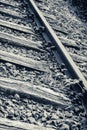 Vertical grayscale closeup shot of train tracks Royalty Free Stock Photo