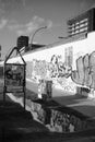 Vertical grayscale of the Eastern part of the Berlin wall with graffiti on it Royalty Free Stock Photo