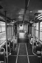 Vertical grayscale of the inside of an empty bus Royalty Free Stock Photo