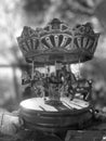 Vertical grayscale of a merry-go-round carousel toy with horses Royalty Free Stock Photo