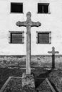 Vertical grayscale shot of an ancient stone cross in San Felices de los Gallegos, Spain