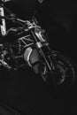 Vertical grayscale shot of Ducati motorcycle, iconic Italian brand