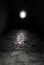 Vertical grayscale shot of the entrance of an Arab bath in Granada, Spain