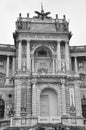 Vertical grayscale shot of the entrance of the Austrian National Library in Vienna, Austria