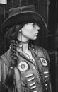 Vertical grayscale shot of a female mannequin with cowboy style clothing