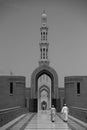 Vertical grayscale shot of the minaret of the Sultan Qaboos Grand Mosque in Muscat, Oman