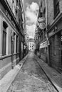 Vertical grayscale shot of a narrow Street in Dublin in monochrome, Ireland