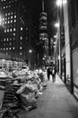 Vertical grayscale shot of NYC streets at night