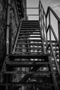 Vertical grayscale shot of outdoor metal staircase
