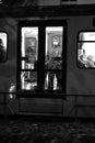 Vertical grayscale shot of people in the subway seen from the windows in Duesseldorf, Germany.